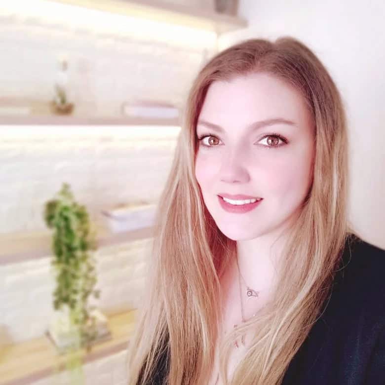 in-person and Online Psychotherapy in Greece 28 Matina Ladikou, the founder of Art of Mind, is seen in a warm, inviting therapy space, engaging in a deep conversation with a client, symbolizing the heart of empathetic psychotherapy.